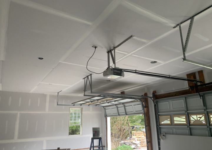 An indoor garage space primed and ready for painting