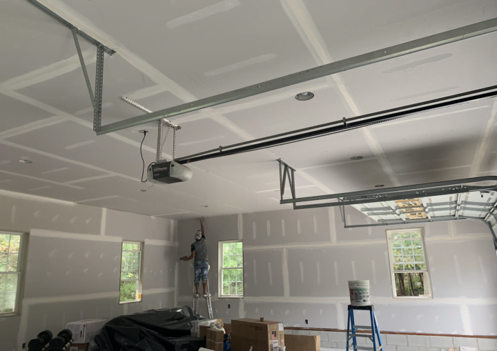 An indoor garage space primed and ready for painting