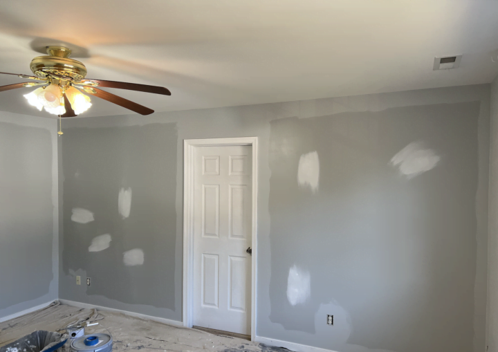 A room in a house being painted gray