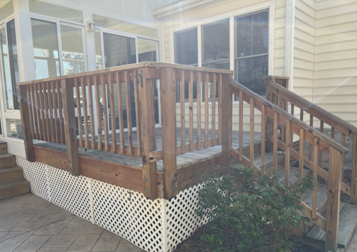 The before shot of a deck that needs to be painted