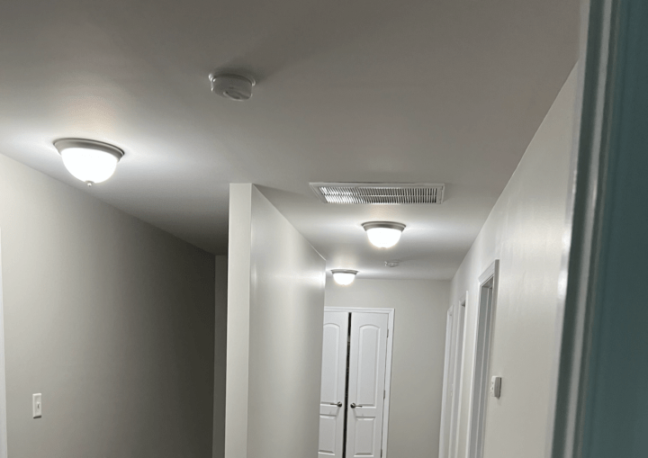 A hallway with a new coat of fresh paint and white trim