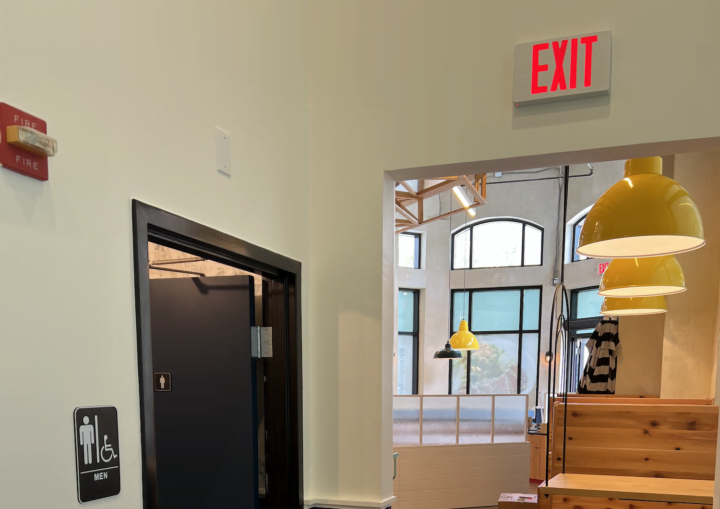 A freshly painted restaurant interior with yellow ceiling lights